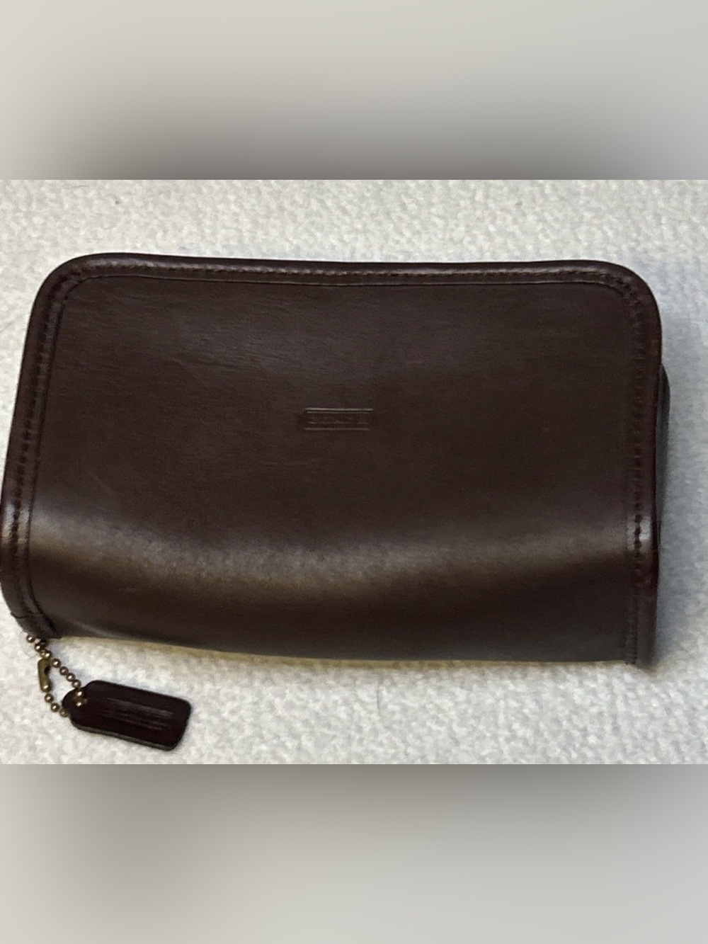 Vintage Coach “chubby” case in mahogany with original mini hangtag